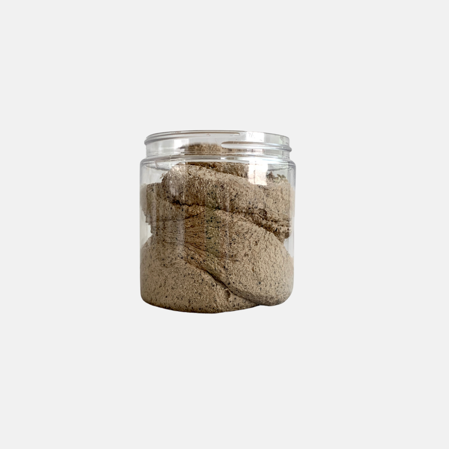 sugar scrub with ground coffee in clear jar